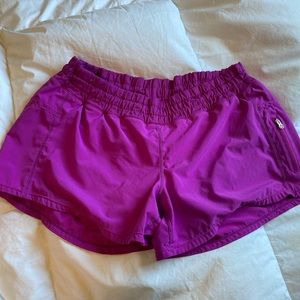 Lululemon women’s Track running shorts size 8 in pink berry colour